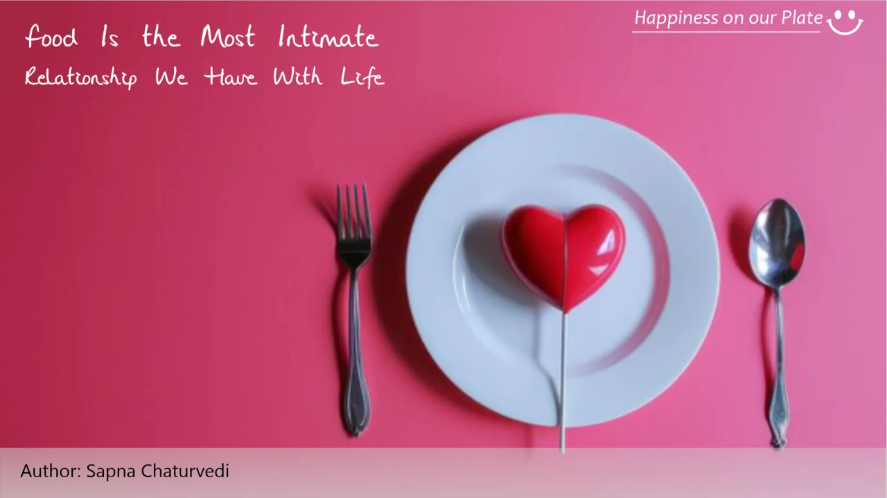 A red heart on a white plate against a pink background.
